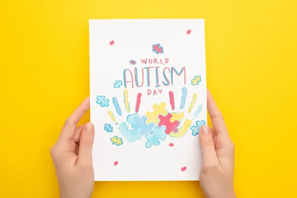 Cropped View Woman Holding Card Puzzle Hand Prints World Autism — Stock Photo, Image