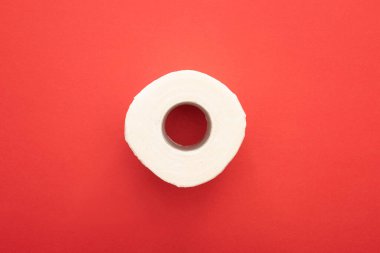 top view of white clean toilet paper roll on red background clipart