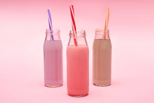 Bottles Colorful Berry Strawberry Chocolate Milkshakes Drinking Straws Pink — Stock Photo, Image