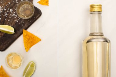 Şişe ve limonlu altın tekila kolajı, ahşap kesim tahtasının yanında tuz ve nachos ve beyaz mermer yüzeyde shot bardakları.