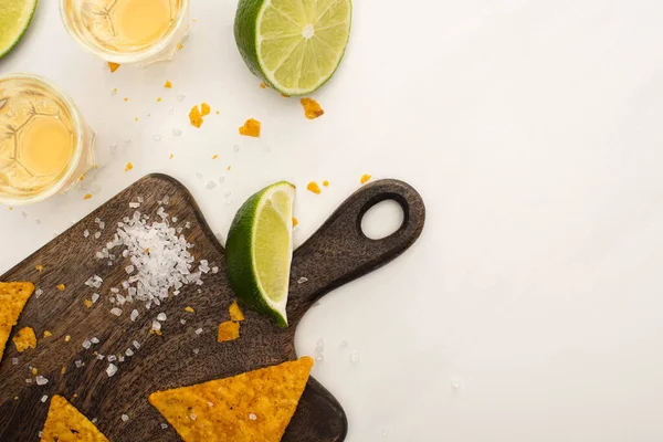 Top View Golden Tequila Shot Glasses Lime Salt Nachos Wooden — Stock Photo, Image