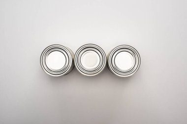 flat lay with silver cans on white background, food donation concept clipart