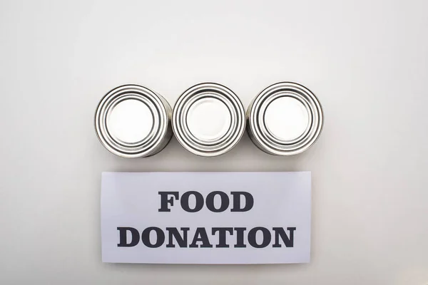 Flat Lay Cans White Background Food Donation Card — Stock Photo, Image