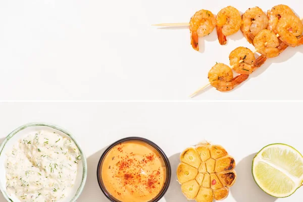 Collage Delicious Fried Prawns Skewers Garlic Lime Sauces White Background — Stock Photo, Image