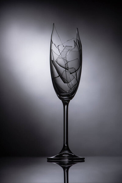 broken sharp glasses on dark black background