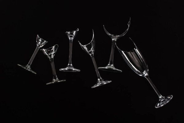 broken sharp transparent glasses isolated on black