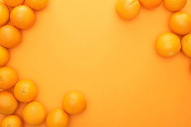 top view of ripe juicy whole oranges on colorful background clipart