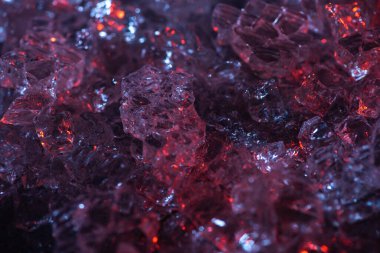 top view of dark abstract red and purple glass textured background clipart