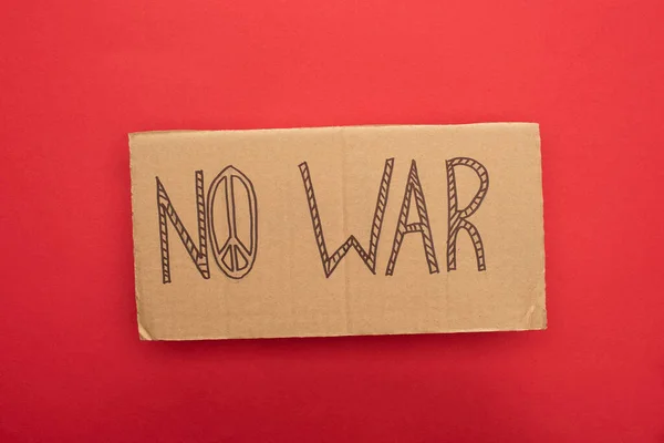 Top View Cardboard Placard War Lettering Peace Sign Red Background — Stock Photo, Image