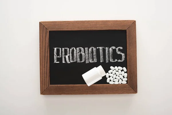 Top View Chalkboard Probiotics Lettering Pills Container White Background — Stock Photo, Image