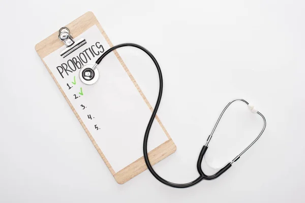 Tilikan Atas Papan Klip Dengan Daftar Kosong Probiotik Dan Stetoskop — Stok Foto