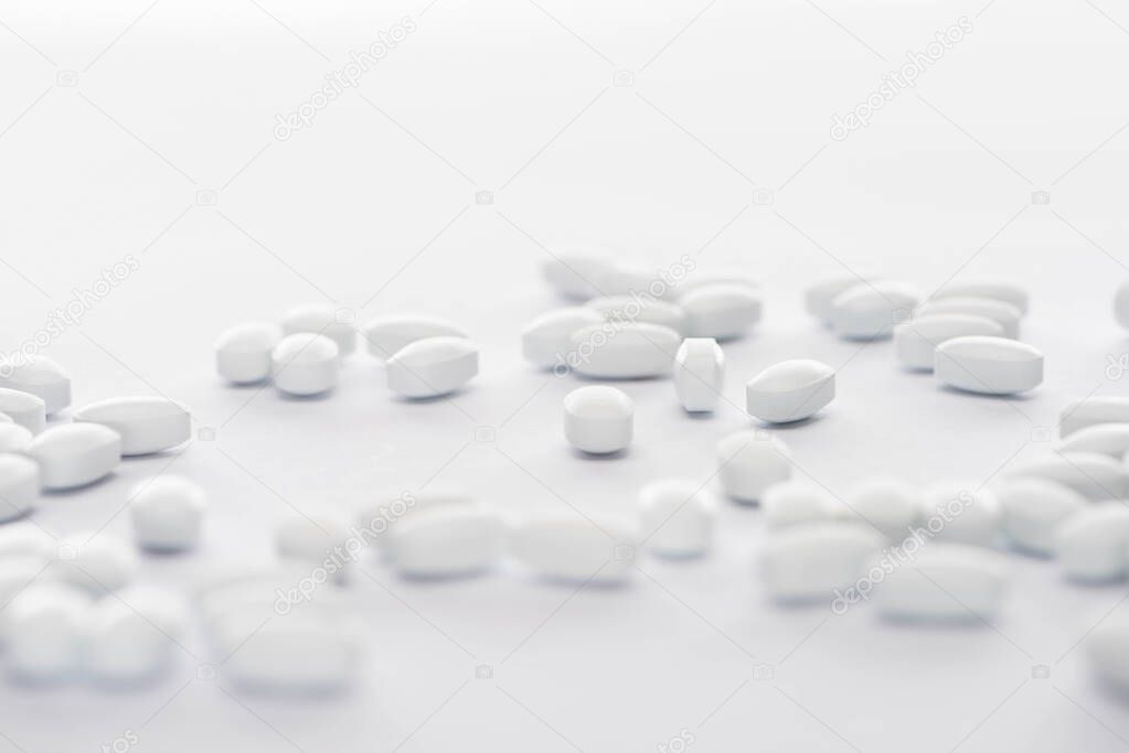 selective focus of probiotic pills on white background