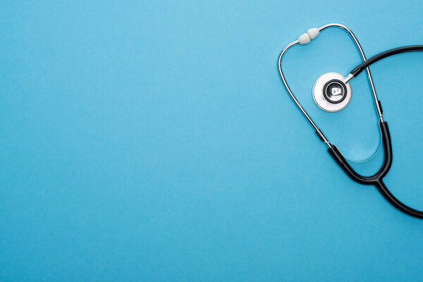 top view of stereoscope on blue background with copy space