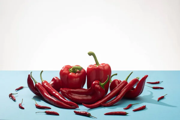 Fresh Red Bell Peppers Chili Blue Surface White Background — Stock Photo, Image