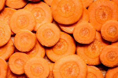 top view of fresh ripe carrot slices background clipart