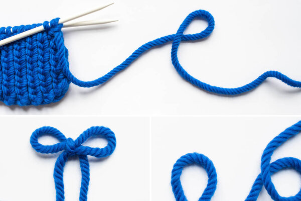 blue wool yarn and knitting needles on white background