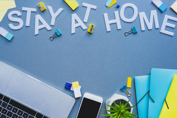 Top View Stay Home Lettering Digital Devices Stationery Blue Surface — Stock Photo, Image