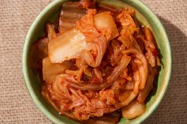 top view of spicy korean kimchi in bowl