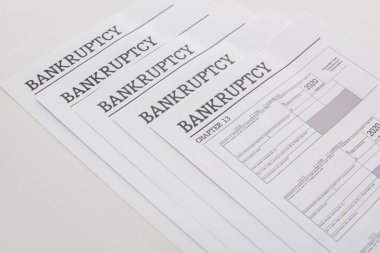 bankruptcy papers on white background with copy space clipart