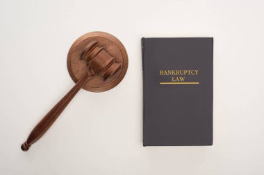 top view of bankruptcy law book and gavel on white background clipart