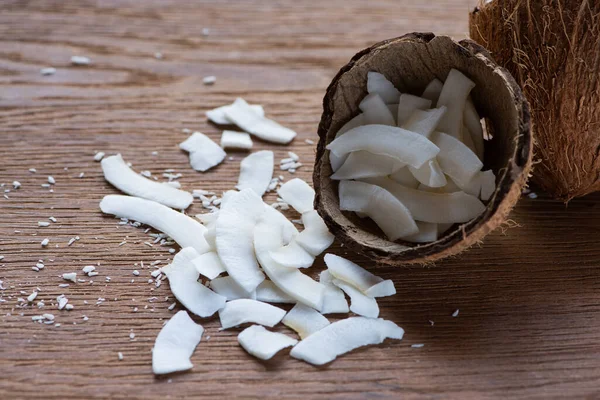 Fresh Tasty Coconut Flakes Shell Wooden Table — Stock Photo, Image