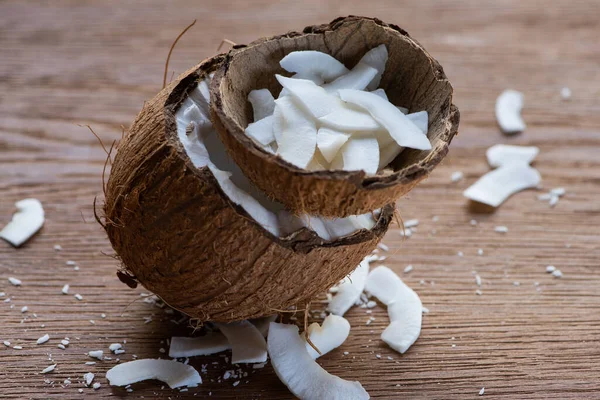 Selective Focus Fresh Tasty Coconut Half Flakes Shell Wooden Table — Stock Photo, Image