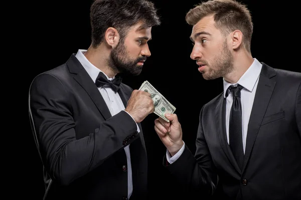 Businessman bribing partner — Stock Photo