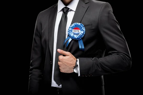 Homme d'affaires avec badge de vote — Photo de stock