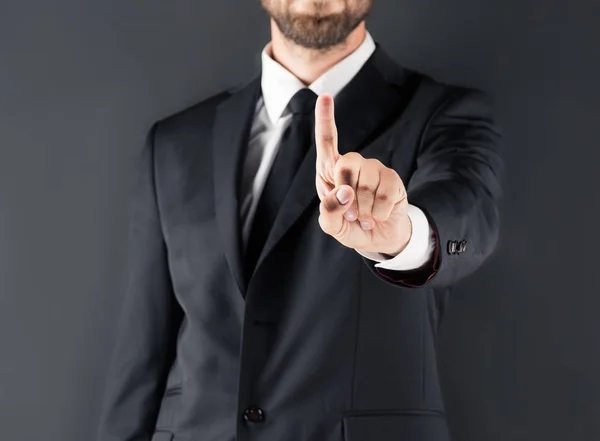 Homme d'affaires pointant du doigt — Photo de stock