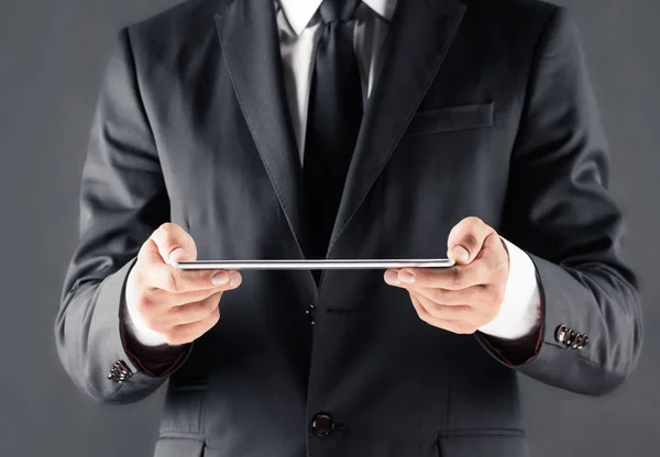 Businessman using digital tablet — Stock Photo