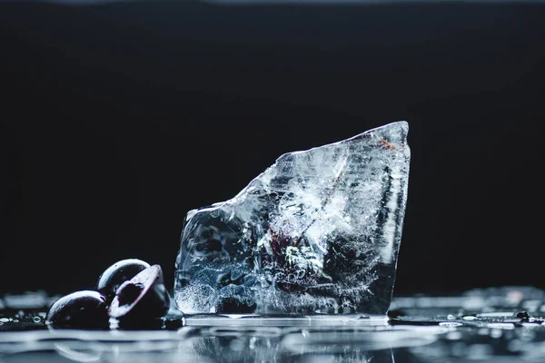 Ripe cherry with ice cube — Stock Photo