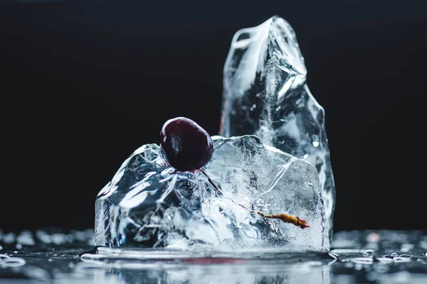 Ripe cherry in ice cube — Stock Photo