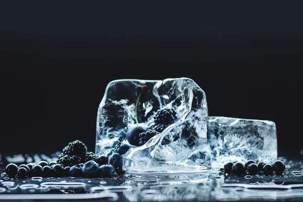 Frozen fruits in ice cubes — Stock Photo