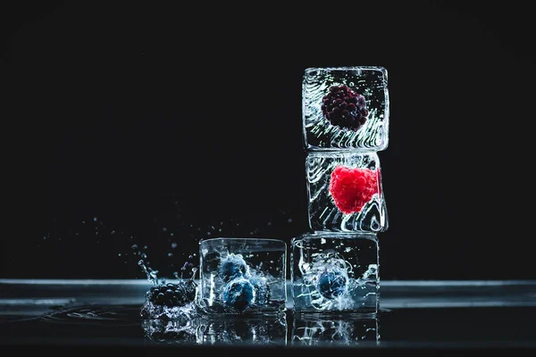 Frozen fruits in ice cubes — Stock Photo