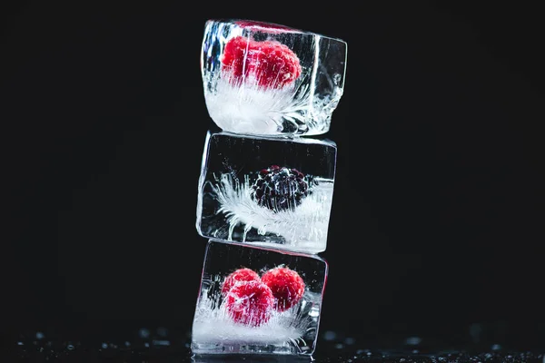 Frozen fruits in ice cubes — Stock Photo