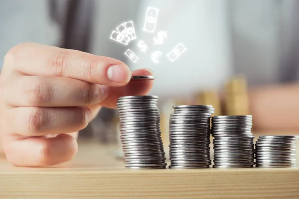 Person stacking coins — Stock Photo