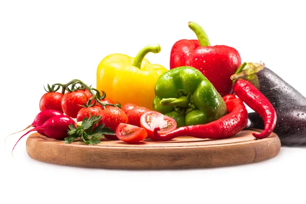 Cherry tomatoes, different peppers and radish — Stock Photo