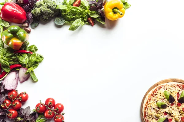 Italian pizza and fresh vegetables — Stock Photo