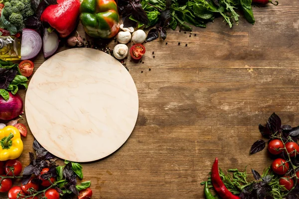 Wooden board and ingredients — Stock Photo