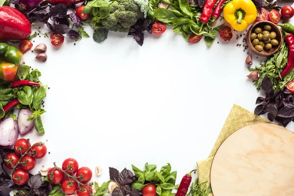 Pizza ingredients and wooden board — Stock Photo