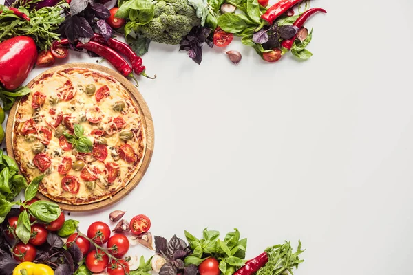 Italian pizza and fresh vegetables — Stock Photo