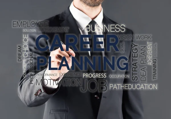 Hombre de negocios escribiendo en panel de vidrio - foto de stock