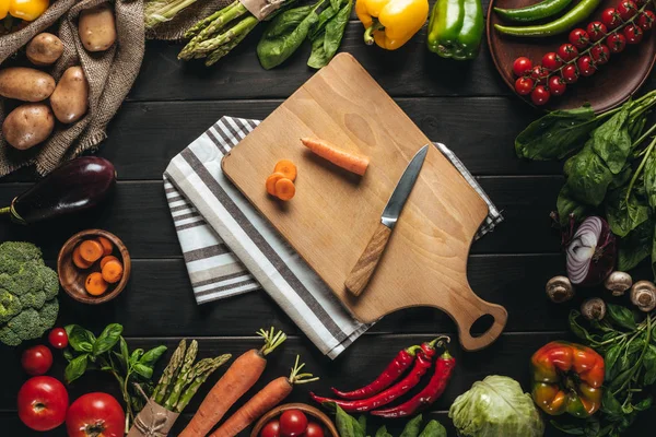 Cutting board with carrot — Stock Photo