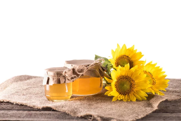 Sunflowers and honey — Stock Photo