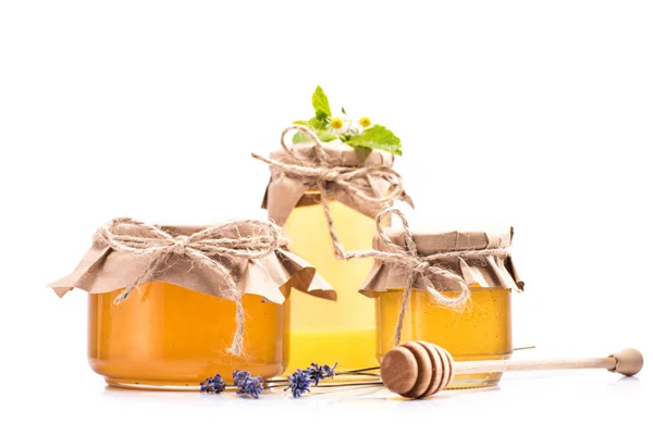 Fresh honey in glass jars — Stock Photo