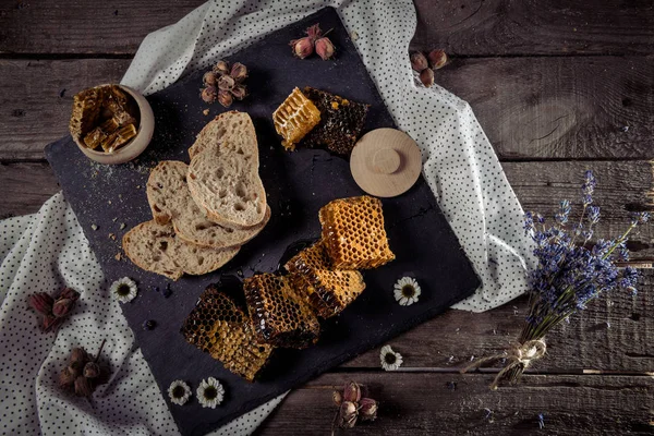 Honeycombs and homemade bread — Stock Photo