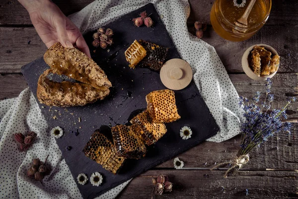 Honeycombs and homemade bread — Stock Photo