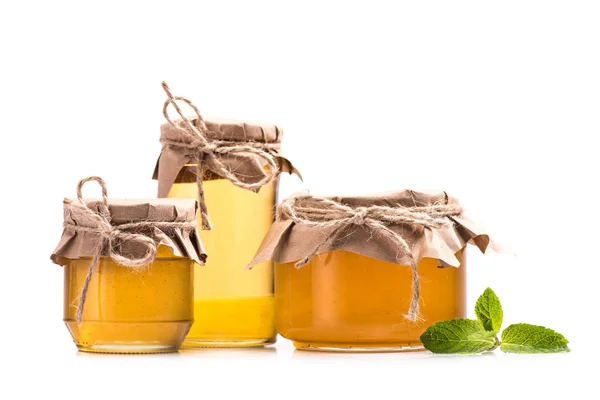 Fresh honey in glass jars — Stock Photo