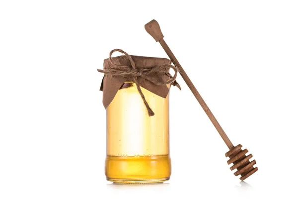 Fresh honey in glass jar — Stock Photo