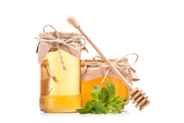 Fresh honey in glass jars — Stock Photo